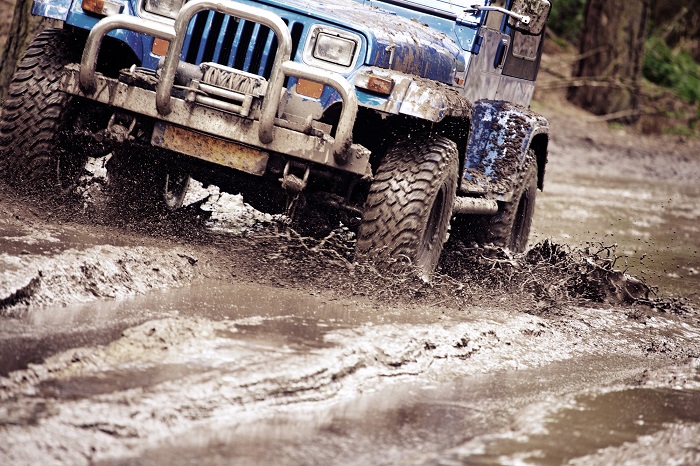 off-road vehicle riding in dirt